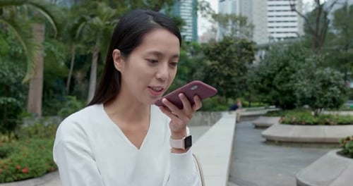 Woman use of mobile phone in city