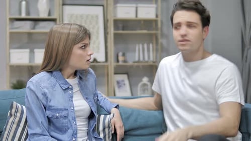 Frustrated Couple Arguing in Living Room