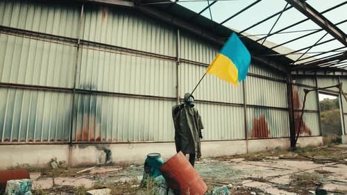 Person Holding Flag in Abandoned Derelict Building