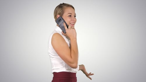 Woman Talking on Phone in Professional Setting