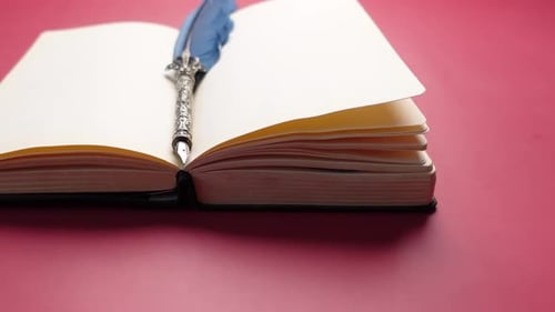 Open Book and Fountain Pen on Table