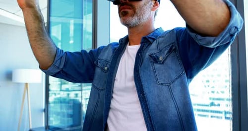 Man Experiencing Virtual Reality Headset in Apartment