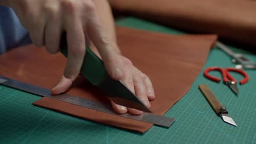 Cutting Leather With Knife And Ruler