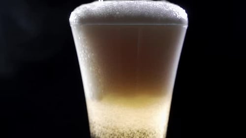 Close Up of Beverage Pouring into Glass