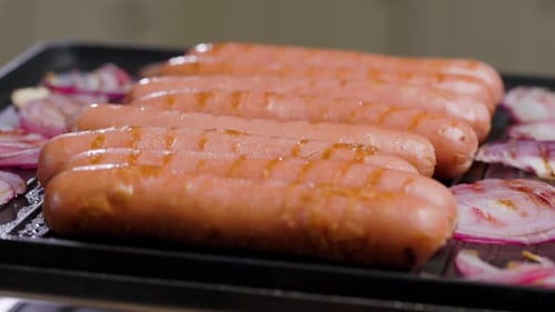 Meat Sausages Are Fried On Grill