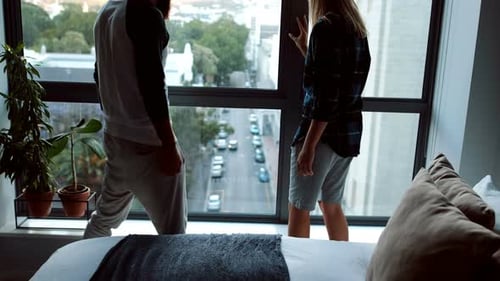 Romantic Couple Hugging in Apartment Overlooking City