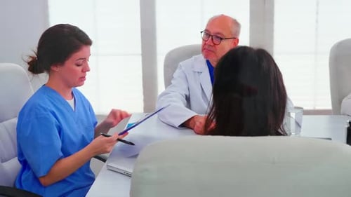 Medical Professionals Meet in Modern Office