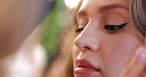 Eyeliner Application on a Young Woman, Close Up