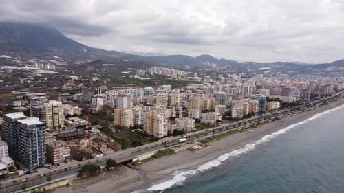 Aerial View Flying over the Resort Town Near the Embankment and the Mediterranean Sea