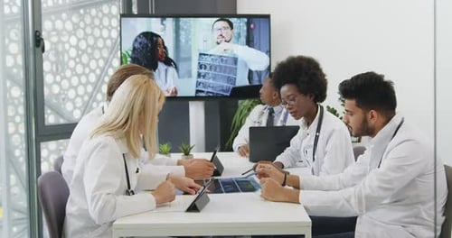 Medical Team Discussing X-rays During a Video Conference