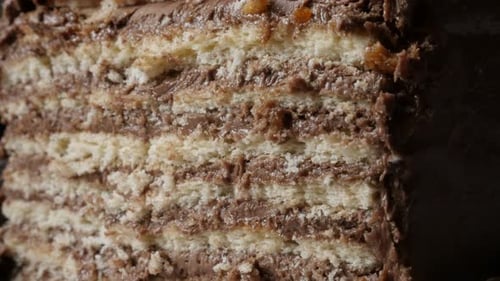 Close-up of different layers of chocolate cake on the plate slow tilt 4K 2160p 30fps UltraHD footage