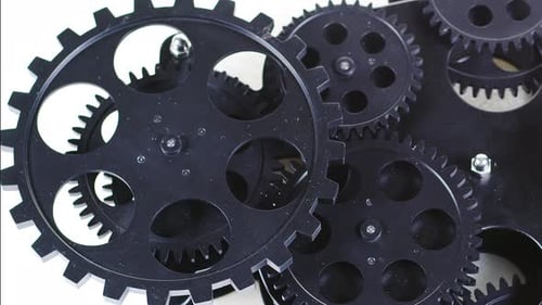 Black Gears Turning Mechanism Close-Up