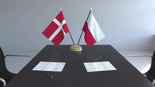 Denmark and Poland Flags on Corporate Meeting Table