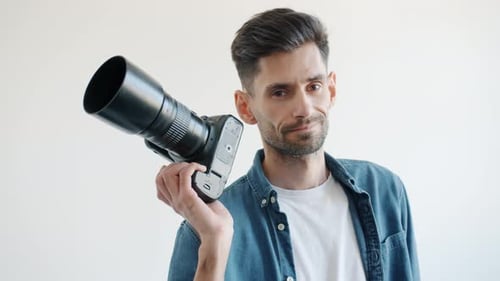 Young Adult Male Poses with Camera