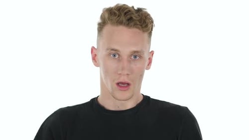 Surprised Young Adult Man Looking at Camera