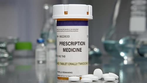 Prescription Medicine Pills Spilling From Bottle in Lab