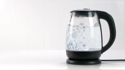 Water Boils in a Glass Electric Kettle