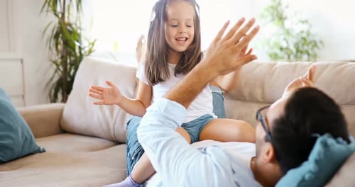 Loving Child Playing with Dad Indoors