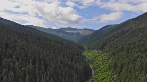 Drone Fly Above in The Clouds Over Mountains In Summer