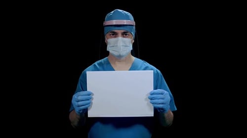 Medical Professional Holding Blank Sign in Protective Gear