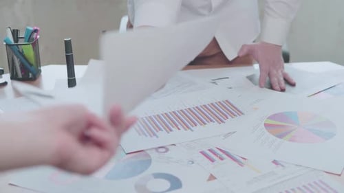 Businessman working with charts in the office at the table