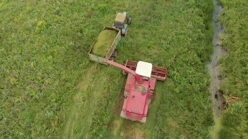 Combine Harvester and Tractor in Rural Field