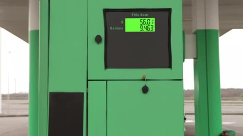 A Gasoline Meter Counter Price at Gas Station Close Up Moment While Refueling a Car Prices Rising
