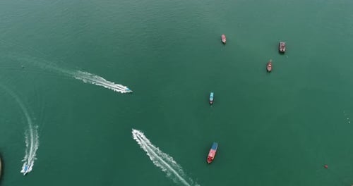 Aerial view of speed boats on the sea near beach city