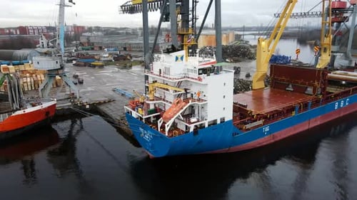 Cargo Ship Docked in Busy Port, Aerial View