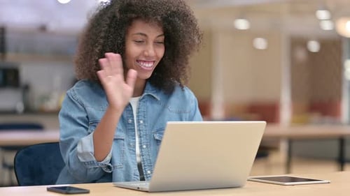 Smiling Woman Talking on Laptop Video Call