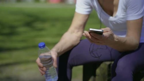 Woman Listening to Music After Workout