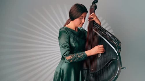 Woman Plays Bandura String Instrument Indoors