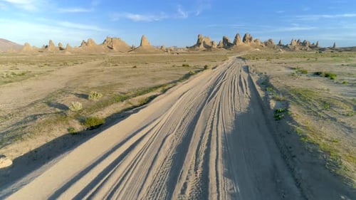 Flying Over the Desert Terrain of Trona Pinnacles on a Sunny Day
