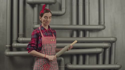 Woman Holding Rolling Pin Wearing Retro Outfit