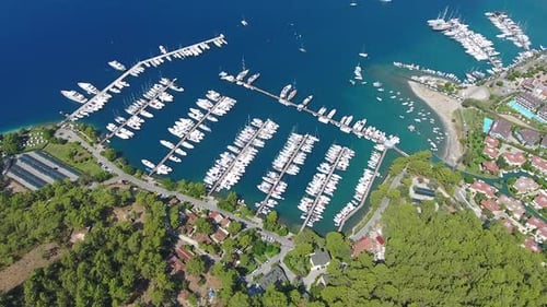 Small City Houses, Beautiful Marina and Touristic Boats in a Cove Surrounded by Forest by Sea