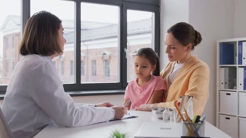 Mother with Little Daughter and Doctor at Clinic