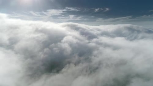 Aerial View of White Clouds Drifting in Sky