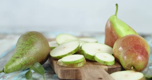 Slices of Fresh Pear on the Cutting Board Slowly Rotate.