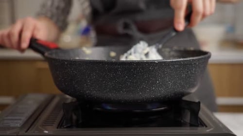 Cooking food in a pan on a gas stove