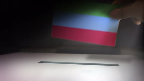 Hand Casting Flag Ballot into Election Box