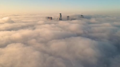 Aerial of the downtown Los Angeles surrounded by clouds