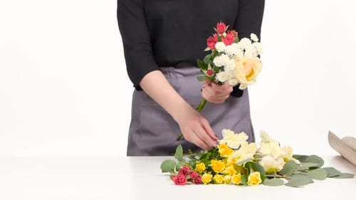 Florist Assemble a Bouquet. White. Close Up