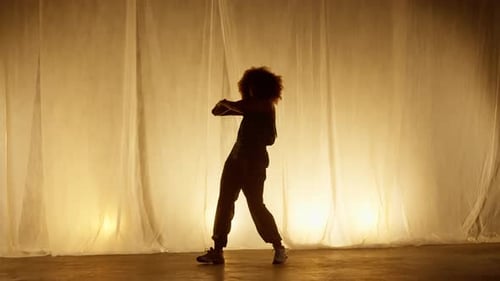 Expressive Woman Dancing in a Studio
