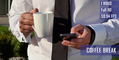 Man Holding Mobile Phone and Coffee Cup Outside