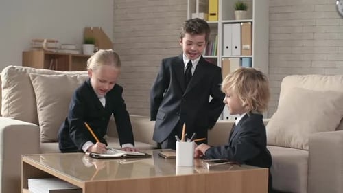 Children Dressed as Business Professionals Collaborate