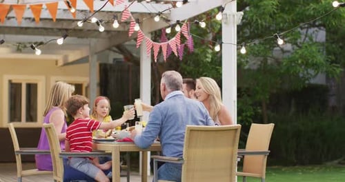 Family and Friends Celebrating Together Outdoors