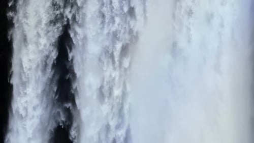 Majestic Waterfall Cascading Down With Immense Natural Force