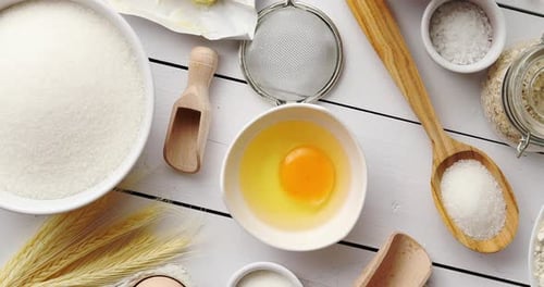 Baking Ingredients Overhead on White Wooden Surface