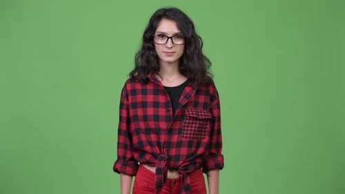 Woman Gives Thumbs Up in Front of Green Screen