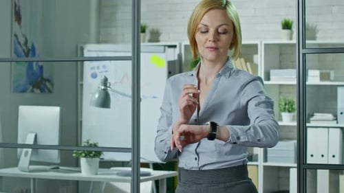 Office Woman Using Smart Watches at Work